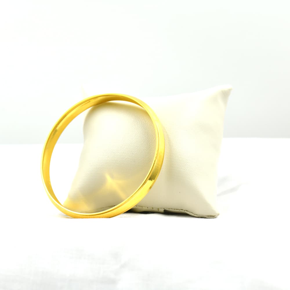 simple gold hand cuff with polished finish