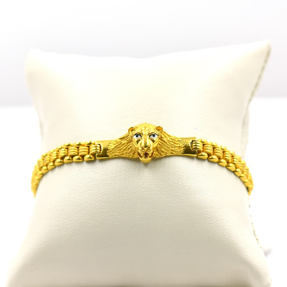 gold bracelet with lion head design