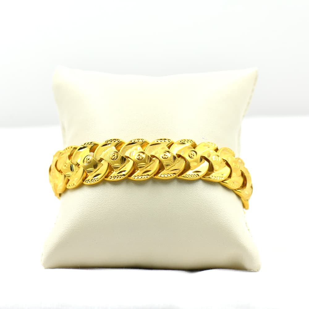 gold bracelet with wide flat curb link design
